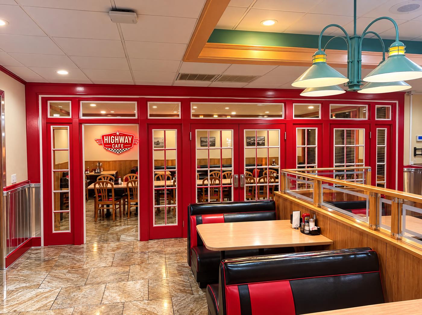 Red glass French doors leading into the Highway Cafe private dining room
